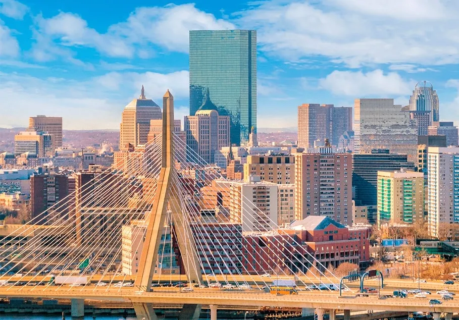 Boston skyline with a bridge over the river offers breathtaking views of the cityscape and waterway.