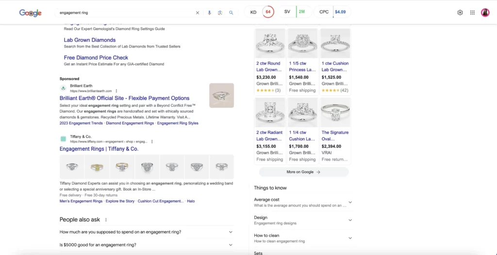 Google search results page for “engagement ring” displaying product ads with images and prices, sponsored listings from Brilliant Earth and Tiffany & Co., and related questions